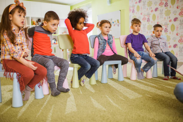 istock Large group of kids attending a class at preschool. 1075973468