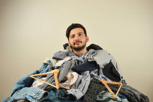 istock Young men cant decide what to wear 1075973968