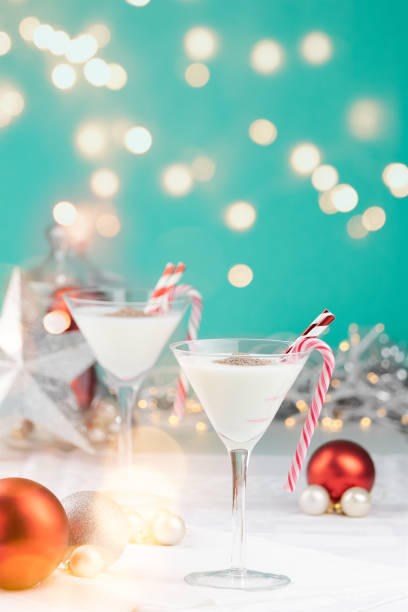 istock White Christmas cocktails in a colorful setting with sparkling lights 1075974906