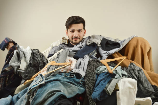 istock Young men cant decide what to wear 1075974942