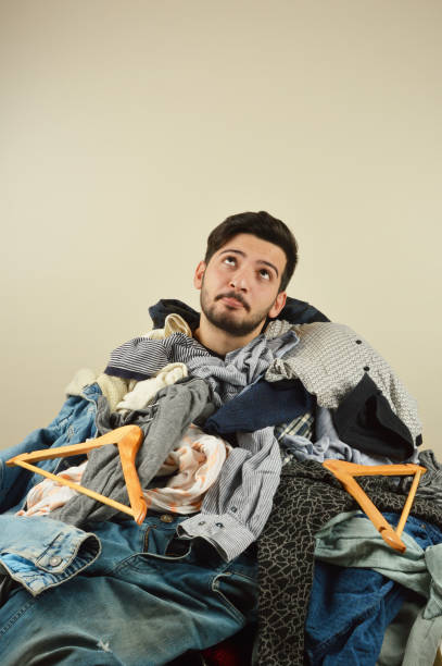 istock Young men cant decide what to wear 1075976624
