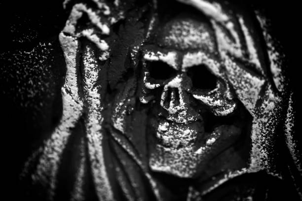 Scary Halloween Symbol Skull on Gravestone Background Photo