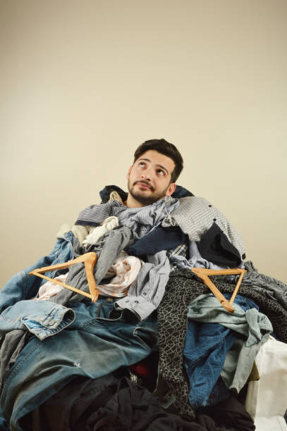 istock Young men cant decide what to wear 1075977484