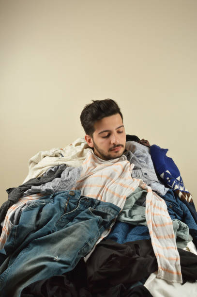 istock Young men cant decide what to wear 1075978276