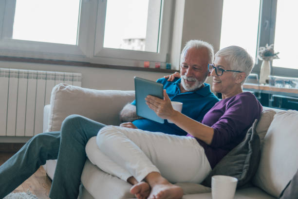 istock Senior people looking at digital tablet 1075982436