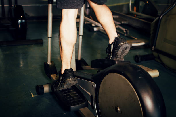 istock Man running in a gym on a treadmill for exercising. 1075990800
