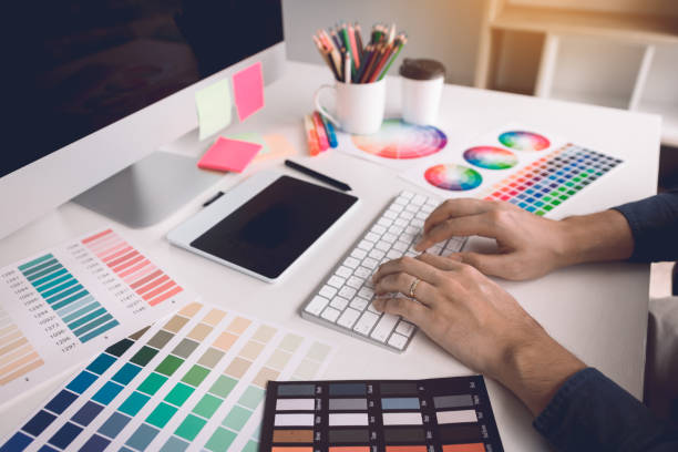 istock Freelance creative designers working on desk  in modern home office. 1075992746