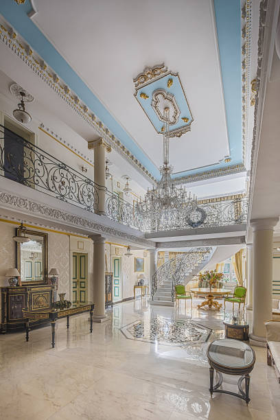 istock luxury lobby interior. Staircase with handmade wrought Iron Railing 1075994534
