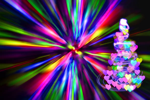 istock christmas tree with many colors in the dark nigt 1075994858