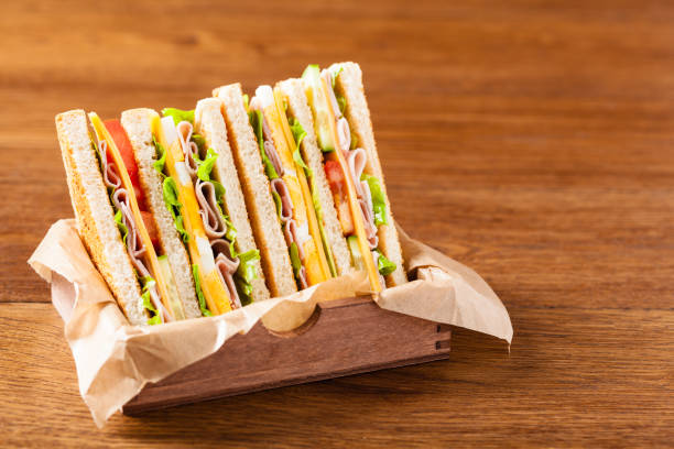 istock Delicious toast sandwich with ham, cheese, egg and vegetables. 1075995622