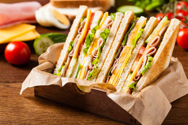 istock Delicious toast sandwich with ham, cheese, egg and vegetables. 1075995658