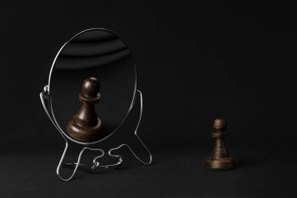 istock black pawn in the mirror 1076002832