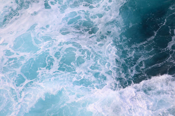 istock blue and white foamy ocean waves 1076008210