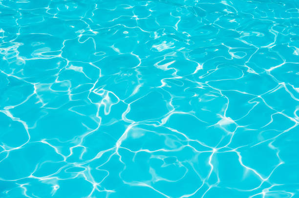 istock Beautiful ripple wave and blue water surface in swimming pool 1076011308