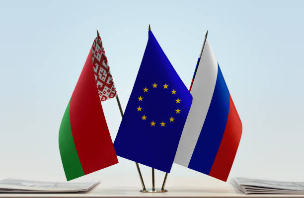 Flags of Belarus European Union and Russia Flags of Belarus and Russia with a EU flag in the middle belarus stock pictures, royalty-free photos & images