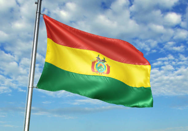 istock Bolivia flag waving cloudy sky background realistic 3d illustration 1076016136