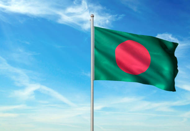 istock Bangladesh flag waving cloudy sky background realistic 1076021088