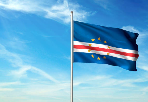 istock Cape Verde flag waving cloudy sky background realistic 1076022310