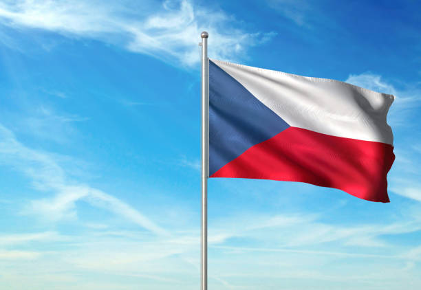 istock Czech Republic flag waving cloudy sky background realistic 1076022468