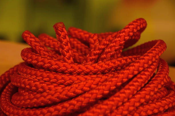 coiled orange industrial rope made of nylon or synthetic