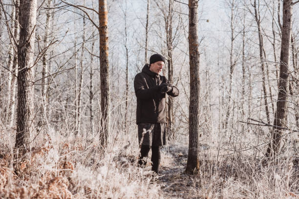 istock Man outdoors in winter doing exercise and training in cold frost weather 1076029052