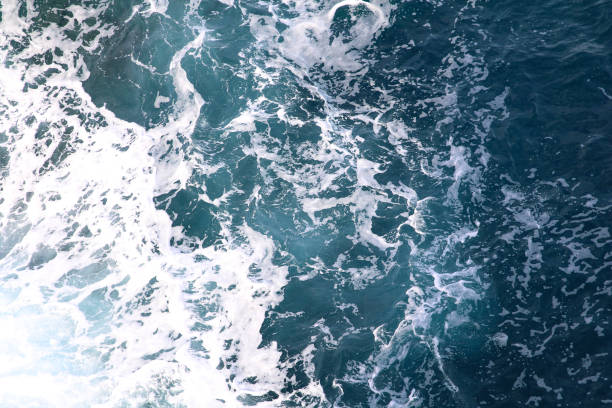 istock blue and white foamy ocean waves 1076031618