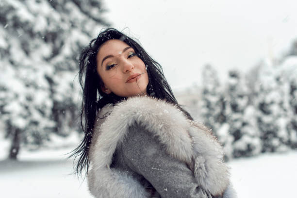 istock Winter walk with a bright brunette 1076037856