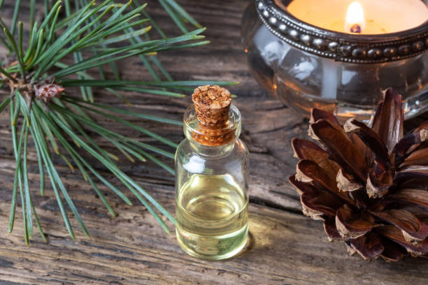 istock A bottle of pine essential oil with fresh pine branches 1076040108
