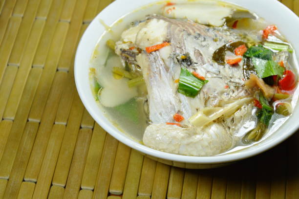 istock spicy boiled Tilapia fish in tom yum soup 1076040322