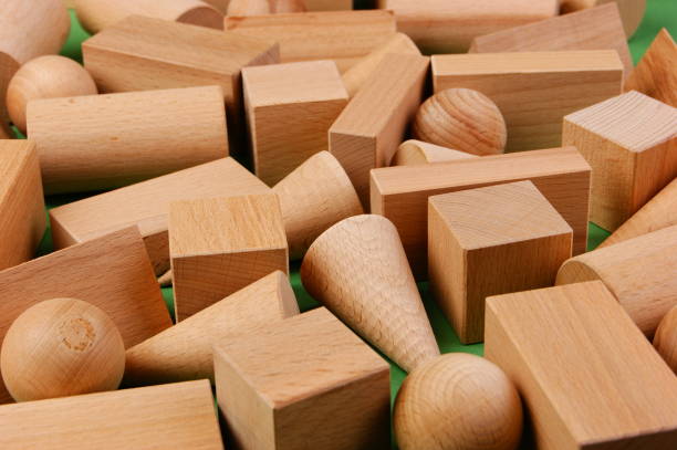istock wooden geometric shapes on a green background 1076045046
