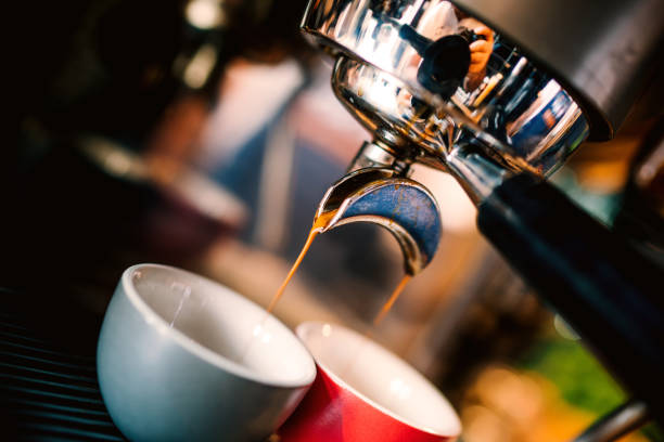 istock Professional brewing - coffee bar details. Espresso details coffee pouring from espresso machine. Barista details in cafe shop 1076045258