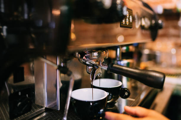 istock Professional espresso machine preparing fresh espresso in two cups in bistro or restaurant 1076045322