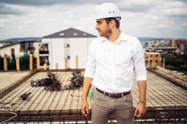istock Portrait of confident architect, engineer on building construction site 1076046068