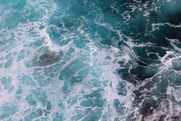 istock blue and white foamy ocean waves 1076046072