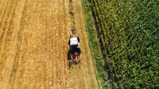 istock harvester using tractor with rotary rakes for collecting hay 1076046686