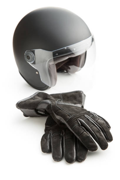 istock Motorcycle gloves and helmet isolated on white background. 1076050670
