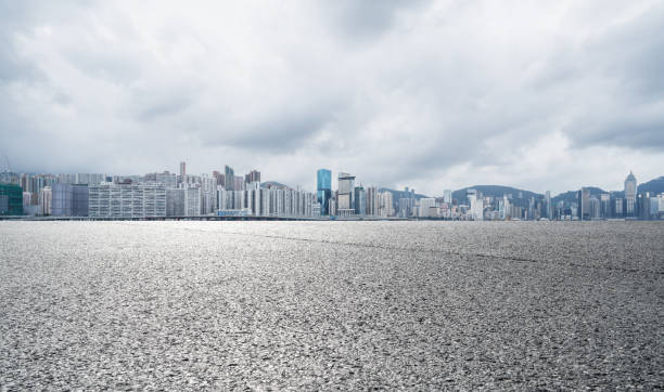 istock Panoramic skyline and buildings with empty road in Hong Kong 1076051098
