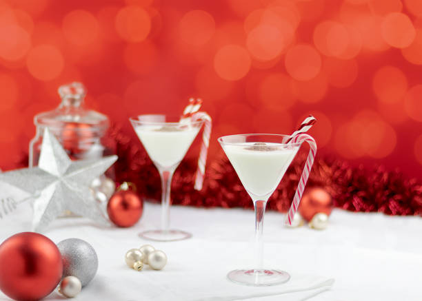 istock elegant white christmas cocktails on a red background 1076051142
