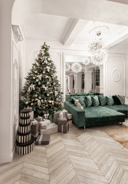 istock Presents and Gift boxes under Christmas Tree. Boxes with ribbon bow. New year decorated house interior. Winter Holiday concept. 1076053680
