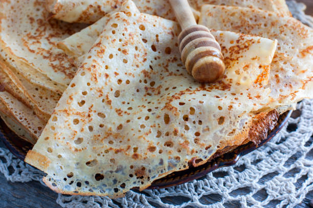 istock Fishnet thin pancakes on the table with a napkin, horizontal 1076054710