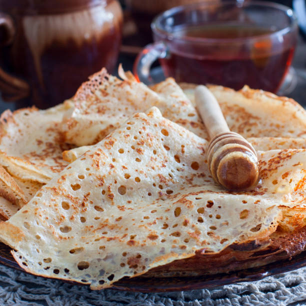 istock Fishnet thin pancakes on the table with a napkin, horizontal 1076054834