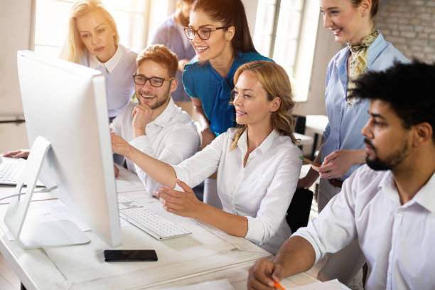 istock Startup business team on meeting in modern bright office interior brainstorming, working on computer 1076058100