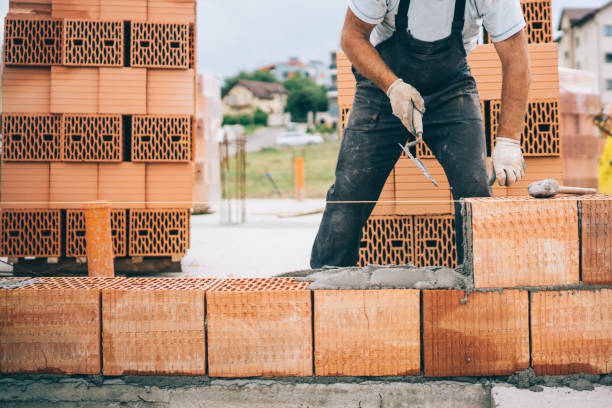 istock industrial construction site details with worker laying bricks 1076060474