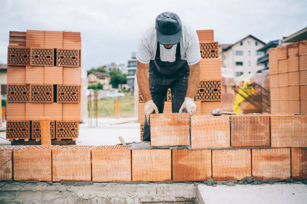 istock details of industrial bricklayer installing bricks on construction building site 1076060502