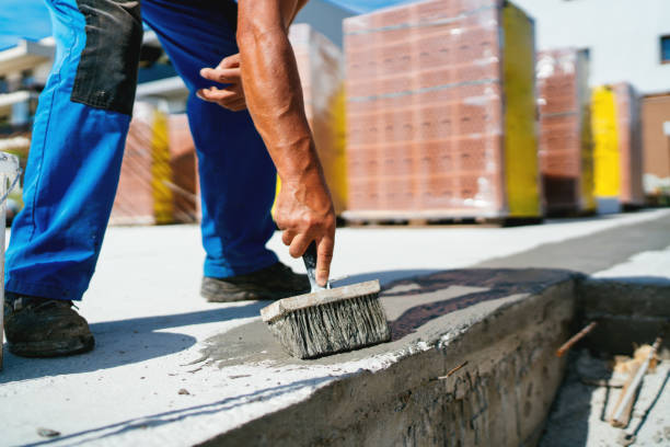 istock industrial worker on construction site laying sealant for waterproofing concrete on construction site 1076062454