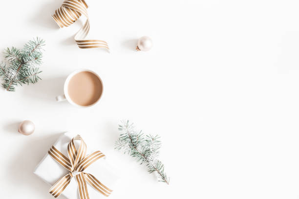 istock Christmas composition. Gift, fir tree branches, cup of coffee, balls on white background. Christmas, winter, new year concept. Flat lay, top view, copy space 1076062938