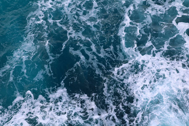 istock blue and white foamy ocean waves 1076065084