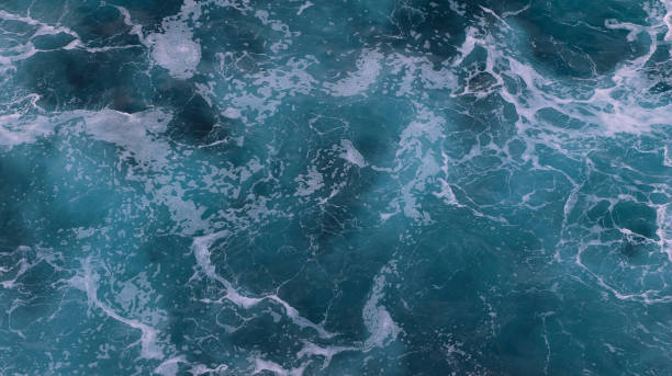 istock blue and white foamy ocean waves 1076071764