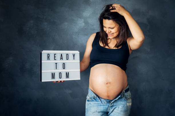 istock ready to become a mother concept - pregnancy shooting in studio 1076074372