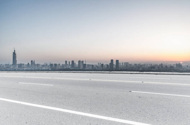 istock Panoramic skyline and buildings with empty road 1076075900